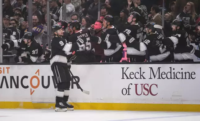 Los Angeles Kings right wing Adrian Kempe (9) celebrates with his team after scoring a goal during the first period of an NHL hockey game against the Philadelphia Flyers, Sunday, Dec. 29, 2024, in Los Angeles. (AP Photo/William Liang)