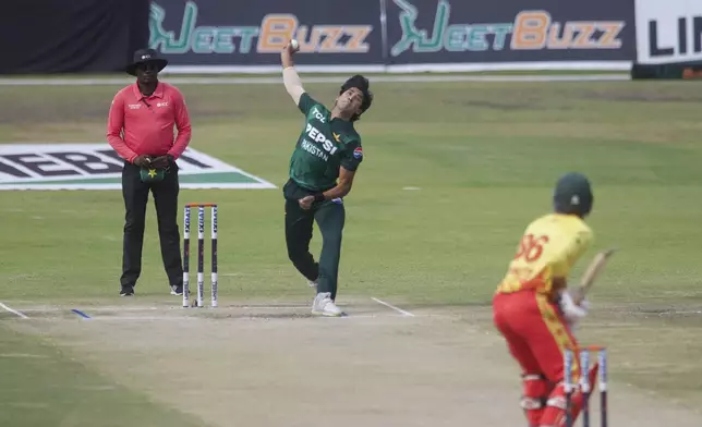 Pakistan's Mohammad Hasnain bowls during the third T20 cricket match between Zimbabwe and Pakistan at Queens Sports Club in Bulawayo, Zimbabwe, Thursday, Dec. 5, 2024. (AP Photo/Wonder Mashura)