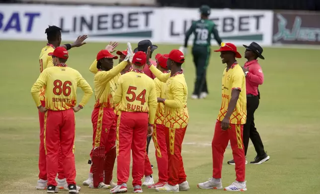 Zimbabwe celebrates a wicket during the third T20 cricket match between Zimbabwe and Pakistan at Queens Sports Club in Bulawayo, Zimbabwe, Thursday, Dec. 5, 2024. (AP Photo/Wonder Mashura)