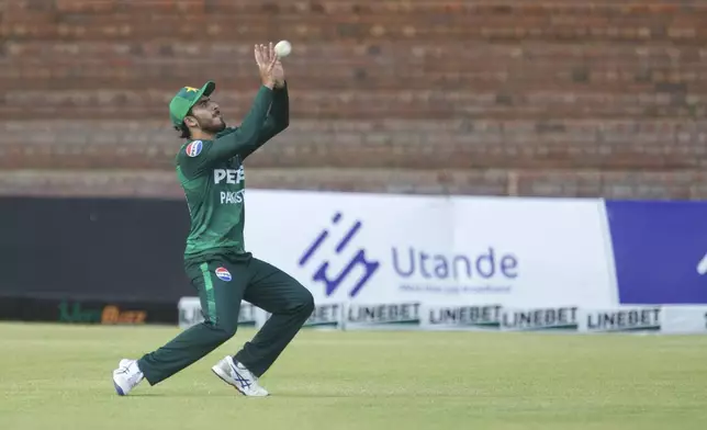 Pakistan's Arafat Minhas catches a ball during the third T20 cricket match between Zimbabwe and Pakistan at Queens Sports Club in Bulawayo, Zimbabwe, Thursday, Dec. 5, 2024. (AP Photo/Wonder Mashura)