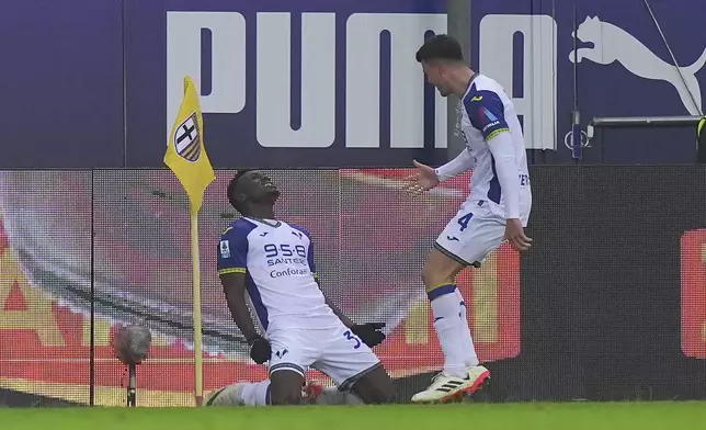 Verona's Daniel Mosquera celebrates after scoring his side's third goal during the Serie A soccer match between Parma and Hellas Verona at Tardini Stadium in Parma, North Italy, Sunday, Dec. 15 , 2024. (Spada/LaPresse via AP)