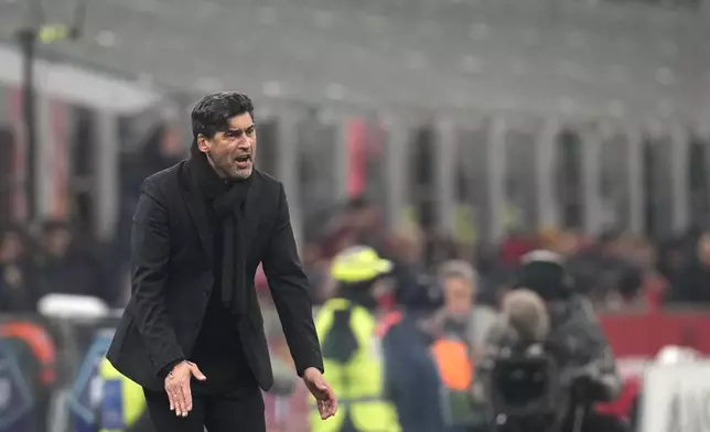 AC Milan's head coach Paulo Fonseca reacts during the Serie A soccer match between AC Milan and Genoa at the San Siro stadium, in Milan, Italy, Sunday, Dec. 15, 2024. (AP Photo/Antonio Calanni)