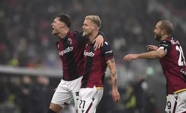 Bologna's Jens Odgaard celebrates after scoring his side's first goal during the Serie A soccer match between Bologna and Fiorentina, at Renato Dall'Ara Stadium in Bologna, Italy, Sunday Dec. 15, 2024. (Massimo Paolone/LaPresse via AP)