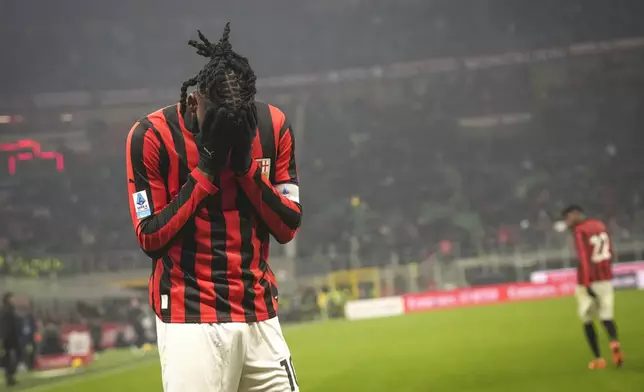 AC Milan's Rafael Leao reacts during the Serie A soccer match between AC Milan and Genoa at the San Siro stadium, in Milan, Italy, Sunday, Dec. 15, 2024. (AP Photo/Antonio Calanni)