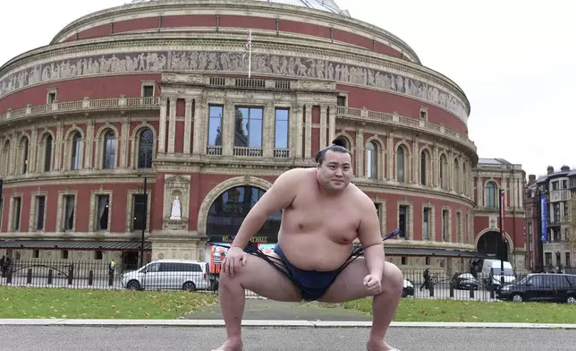 Rishiki from Japan's Sumo Kyokai, Daisuke Kitanowaka poses for a photo call outside of London's Royal Albert Hall in London, Wednesday, Dec. 4, 2024 where the UK's second ever official basho will take place in October of next year. (AP Photo/Thomas Krych)