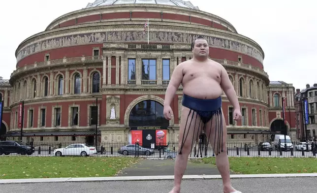 Rishikis from Japan's Sumo Kyokai, Daisuke Kitanowaka poses for a photo call outside of London's Royal Albert Hall, where the UK's second ever official basho will take place in October of next year in London, Wednesday, Dec. 4, 2024.(AP Photo/Thomas Krych)