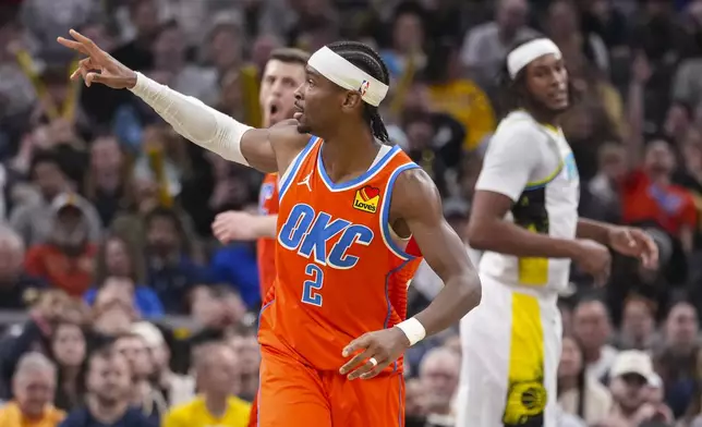 Oklahoma City Thunder guard Shai Gilgeous-Alexander (2) gestures after a three-point basket against the Indiana Pacers during the second half of an NBA basketball game in Indianapolis, Thursday, Dec. 26, 2024. (AP Photo/Michael Conroy)