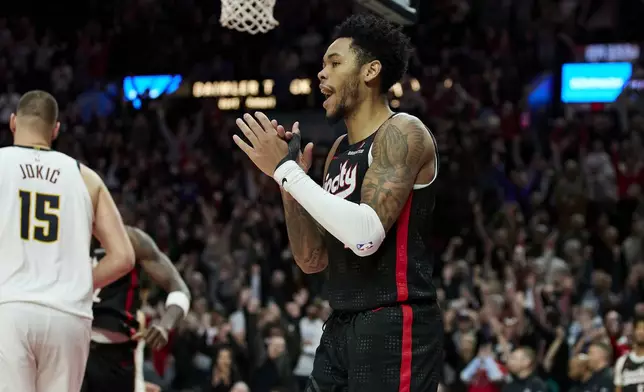 Portland Trail Blazers guard Anfernee Simons celebrates his game-winning basket against the Denver Nuggets during the second half of an NBA basketball game in Portland, Ore., Thursday, Dec. 19, 2024. (AP Photo/Craig Mitchelldyer)