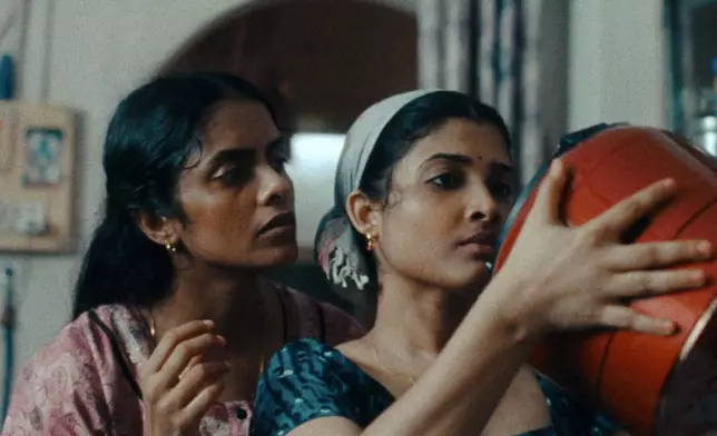 This image released by Janus and Sideshow Films shows Kani Kusruti, left, and Divya Prabha in a scene from "All We Imagine As Light." (Janus and Sideshow Films via AP)