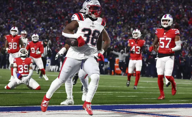 New England Patriots running back Rhamondre Stevenson (38) carries the ball for a touchdown against the Buffalo Bills during the second quarter of an NFL football game, Sunday, Dec. 22, 2024, in Orchard Park, N.Y.. (AP Photo/Jeffrey T. Barnes)