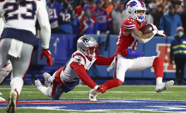 Buffalo Bills wide receiver Khalil Shakir (10) avoids a tackle from the New England Patriots during the third quarter of an NFL football game, Sunday, Dec. 22, 2024, in Orchard Park, N.Y.. (AP Photo/Jeffrey T. Barnes)