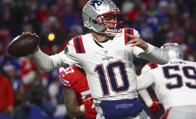 New England Patriots quarterback Drake Maye (10) passes against the Buffalo Bills during the second quarter of an NFL football game, Sunday, Dec. 22, 2024, in Orchard Park, N.Y.. (AP Photo/Jeffrey T. Barnes)