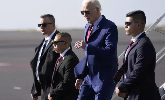 President Joe Biden arrives at Amilcar Cabral international airport on Sal island, Cape Verde Monday, Dec. 2, 2024, en route to Angola as he makes his long-promised visit to Africa. (AP Photo/Ben Curtis)