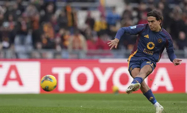 Roma's Paulo Dybala scores his side's opening goal during the Italian Serie A soccer match between Roma and Parma at Rome's Olympic stadium, Sunday Dec. 22, 2024. (Alfredo Falcone/LaPresse via AP)