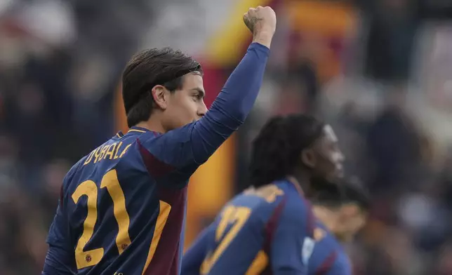 Roma's Paulo Dybala celebrates after scoring during the Italian Serie A soccer match between Roma and Parma at Rome's Olympic stadium, Sunday Dec. 22, 2024. (Alfredo Falcone/LaPresse via AP)