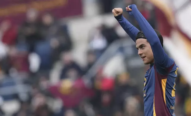 Roma's Paulo Dybala celebrates after scoring his side's third goal during the Italian Serie A soccer match between Roma and Parma at Rome's Olympic stadium, Sunday Dec. 22, 2024. (Alfredo Falcone/LaPresse via AP)