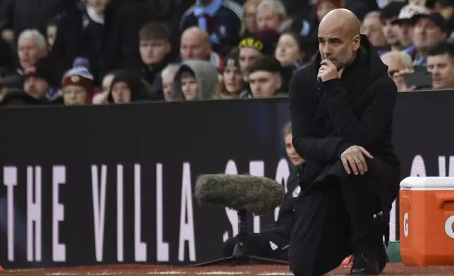 Manchester City's head coach Pep Guardiola reacts during the English Premier League soccer match between Aston Villa and Manchester City, at Villa Park in Birmingham, England, Saturday, Dec. 21, 2024. (AP Photo/Rui Vieira)