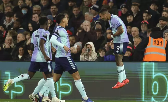 Arsenal's Gabriel Jesus, right, celebrates with his teammates after scoring his side's second goal during the English Premier League soccer match between Crystal Palace and Arsenal, at Selhurst Park, in Luton, England, Saturday, Dec. 21, 2024. (AP Photo/Ian Walton)