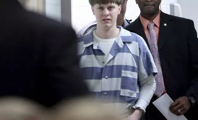 FILE - Dylann Roof enters the court room at the Charleston County Judicial Center on April 10, 2017, in Charleston, S.C. (Grace Beahm/The Post And Courier via AP, Pool, File)