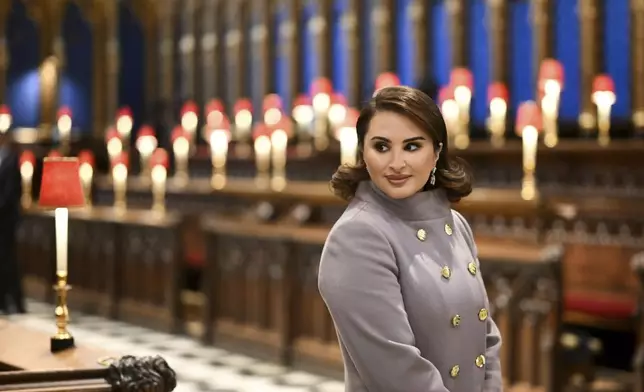 Wife of Qatar's Emir, Sheikha Jawaher bint Hamad bin Suhaim al-Thani during a visit to Westminster Abbey in London, Tuesday, Dec. 3, 2024, on the first day of their two-day State Visit to Britain. ( Justin Tallis/Pool photo via AP)