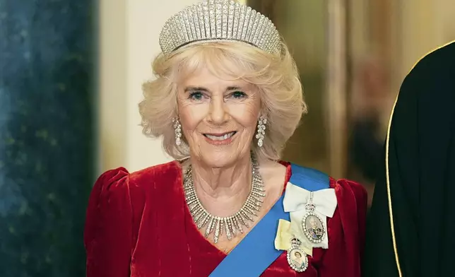 Britain's Queen Camilla ahead of a state banquet at Buckingham Palace, in London, Tuesday, Dec. 3, 2024, during the Emir of Qatar's state visit to the U.K. (Aaron Chown/Pool Photo via AP)