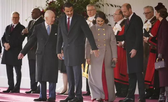 Britain's Kate, Princess of Wales, right, Prince William and King Charles III, left, welcome the Emir of the State of Qatar Sheikh Tamim bin Hamad Al Thani and Sheikha Jawaher bint Hamad bin Suhaim Al Thani in London, Tuesday, Dec. 3, 2024. (AP Photo/Kin Cheung, Pool)