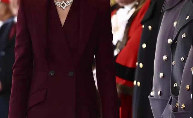 Britain's Catherine, Princess of Wales, greets dignitaries as she arrives ahead of a Ceremonial Welcome for the Emir of Qatar Sheikh Tamim bin Hamad Al Thani and his wife Sheikha Jawaher, at Horse Guards Parade in London, Tuesday Dec. 3, 2024. (Henry Nicholls via AP, Pool)