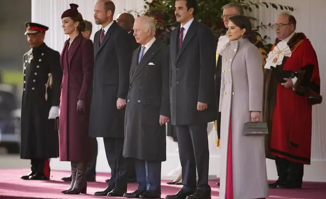 Britain's Kate, Princess of Wales, Prince William and King Charles III, from left, welcome the Emir of the State of Qatar Sheikh Tamim bin Hamad Al Thani, second right, and Sheikha Jawaher bint Hamad bin Suhaim Al Thani in London, Tuesday, Dec. 3, 2024. (AP Photo/Kin Cheung, Pool)