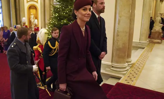 Britain's Prince William and Kate, Princess of Wales arrive at Buckingham Palace, London during the state visit to the UK of the Emir of Qatar Tuesday Dec. 3, 2024. (Jonathan Brady, Pool via AP)