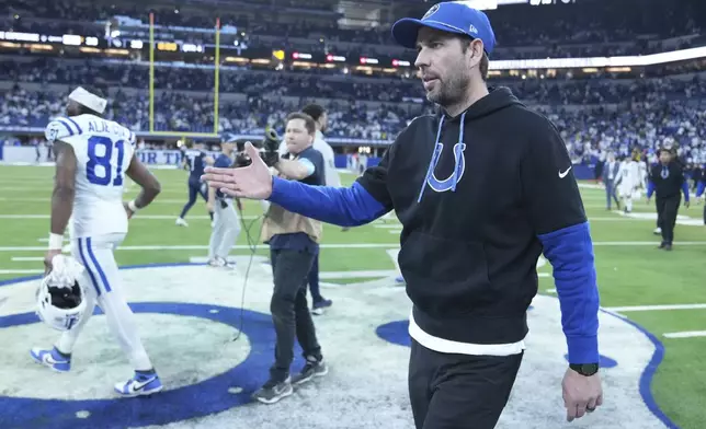 Indianapolis Colts head coach Shane Steichen walks to midfield after the team's win against the Tennessee Titans in an NFL football game Sunday, Dec. 22, 2024, in Indianapolis. (AP Photo/Michael Conroy)