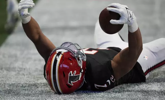 Atlanta Falcons running back Bijan Robinson (7) reacts to being tackled just short of the goal line in the second half of an NFL football game against the New York Giants in Atlanta, Sunday, Dec. 22, 2024. (AP Photo/Mike Stewart)