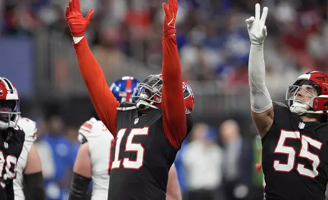 Atlanta Falcons' Matthew Judon celebrates sacking New York Giants quarterback Drew Lock (2) in the second half of an NFL football game in Atlanta, Sunday, Dec. 22, 2024. (AP Photo/Mike Stewart)