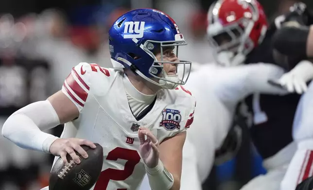 New York Giants quarterback Drew Lock (2) looks to pass in the first half of an NFL football game against the Atlanta Falcons in Atlanta, Sunday, Dec. 22, 2024. (AP Photo/John Bazemore)