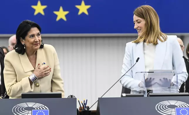 Georgian outgoing President Salome Zourabichvili , left, gestures as European Parliament president Roberta Metsola looks on, Wednesday, Dec. 18, 2024 in Strasbourg, eastern France. (AP Photo/Pascal Bastien)