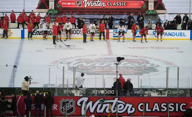 The Chicago Blackhawks practice on the day before the NHL Winter Classic outdoor hockey game featuring the Blackhawks and the St. Louis Blues at Wrigley Field, Monday, Dec. 30, 2024, in Chicago. (AP Photo/Erin Hooley)