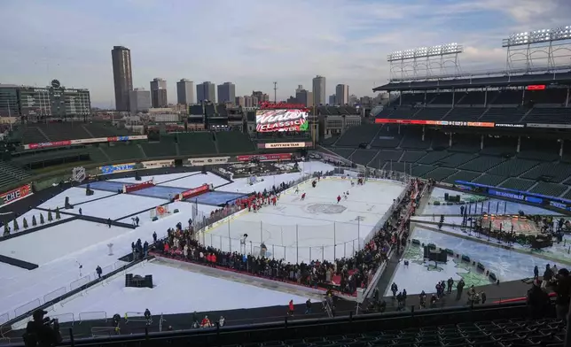 The Chicago Blackhawks practice on the day before the NHL Winter Classic outdoor hockey game featuring the Blackhawks and the St. Louis Blues at Wrigley Field, Monday, Dec. 30, 2024, in Chicago. (AP Photo/Erin Hooley)