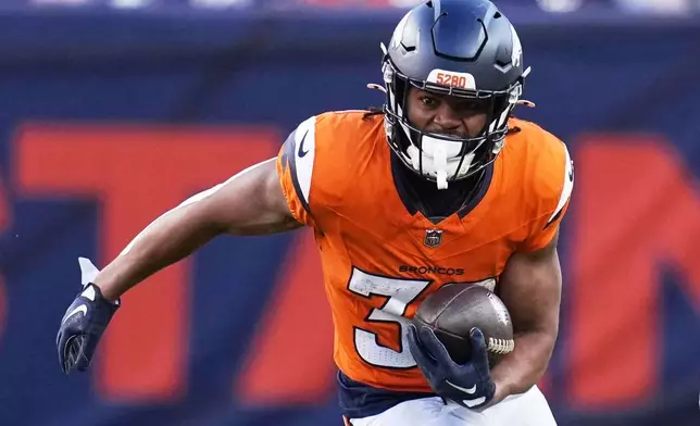 Denver Broncos' Jaleel McLaughlin runs during the first half of an NFL football game against the Indianapolis Colts Sunday, Dec. 15, 2024, in Denver. (AP Photo/Jack Dempsey)
