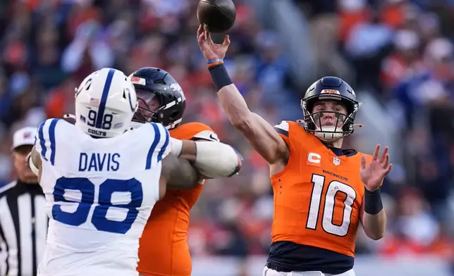 Denver Broncos' Bo Nix throws during the first half of an NFL football game against the Indianapolis Colts Sunday, Dec. 15, 2024, in Denver. (AP Photo/Jack Dempsey)
