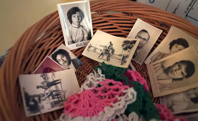 Photos of the late Amada Cardenas, who was one of the first federally licensed peyote dealers, alongside her husband, to harvest and sell the sacramental plant to followers of the Native American Church, in Mirando City, Texas, Monday, March 25, 2024. (AP Photo/Jessie Wardarski)