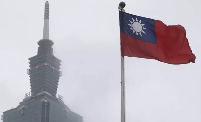 FILE - A Taiwan national flag flutters near the Taipei 101 building at the National Dr. Sun Yat-Sen Memorial Hall in Taipei, Taiwan, May 7, 2023. (AP Photo/Chiang Ying-ying, File)