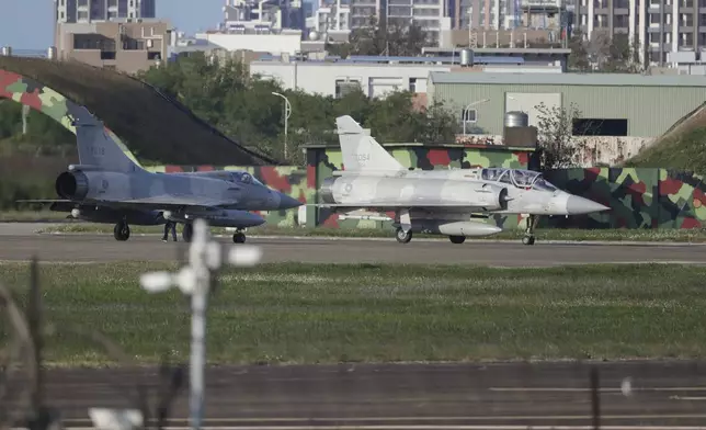 Taiwan's fighter jets prepare to take off at an airbase in Hsinchu, northern Taiwan, Tuesday, Dec. 10, 2024, as Taiwan's Defense Ministry said it detected Chinese naval ships and military planes engaged in training. (AP Photo/Chiang Ying-ying)