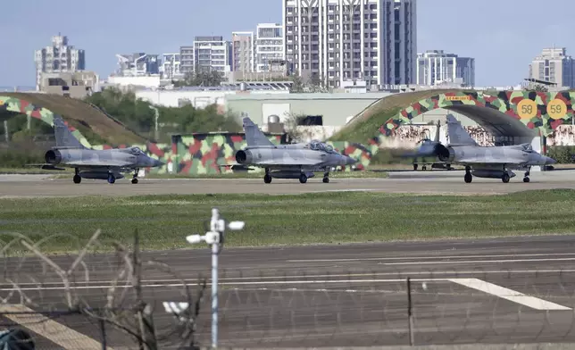 Taiwan's Mirage 2000 fighter jets sit on the tarmac at an airbase in Hsinchu, northern Taiwan, Tuesday, Dec. 10, 2024, as Taiwan's Defense Ministry said it detected Chinese naval ships and military planes engaged in training. (AP Photo/Chiang Ying-ying)