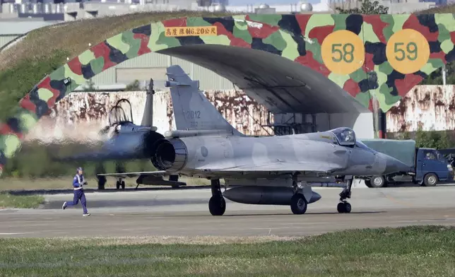 A Taiwan's Mirage 2000 fighter jet prepares to take off at an airbase in Hsinchu, northern Taiwan, Tuesday, Dec. 10, 2024, as Taiwan's Defense Ministry said it detected Chinese naval ships and military planes engaged in training. (AP Photo/Chiang Ying-ying)