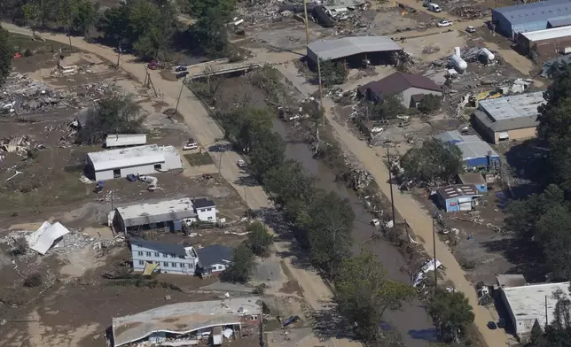 FILE - Damage from Hurricane Helene near Asheville, N.C., is seen during an aerial tour for President Joe Biden, Oct. 2, 2024. (AP Photo/Susan Walsh, File)