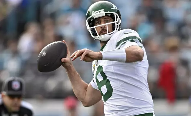 New York Jets quarterback Aaron Rodgers (8) throws a pass against the Jacksonville Jaguars during the second half of an NFL football game Sunday, Dec. 15, 2024, in Jacksonville, Fla. (AP Photo/Phelan M. Ebenhack)