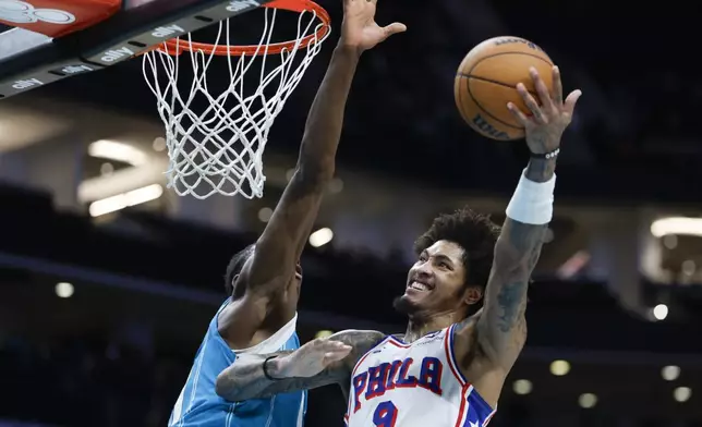 Philadelphia 76ers guard Kelly Oubre Jr. (9) drives to the basket against Charlotte Hornets forward Moussa Diabate, left, during the second half of an NBA basketball game in Charlotte, N.C., Monday, Dec. 16, 2024. (AP Photo/Nell Redmond)