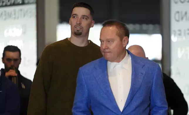 Los Angeles Dodgers newly signed pitcher Blake Snell, left, and his agent Scott Boras, right, arrive for a news conference, Tuesday, Dec. 3, 2024, in Los Angeles. (AP Photo/Jae C. Hong)