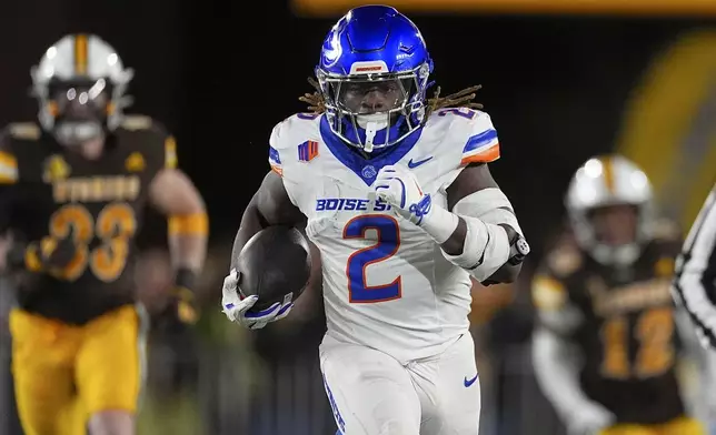 Boise State running back Ashton Jeanty (2) in the first half of an NCAA college football game Saturday, Nov. 23, 2024, in Laramie, Wyo. (AP Photo/David Zalubowski)