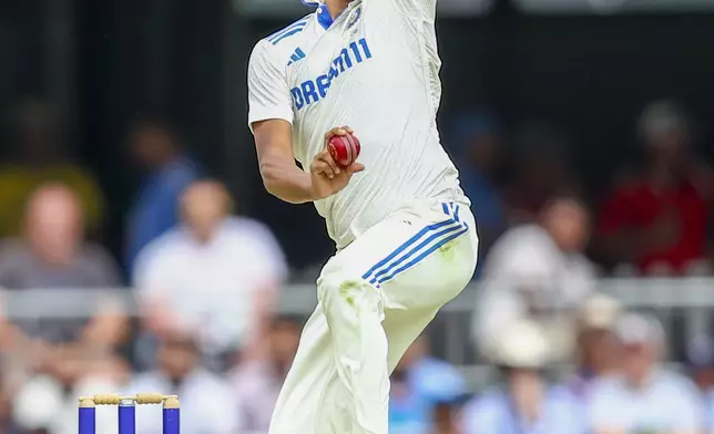 India's Mohammed Siraj bowls a delivery during play on day one of the third cricket test between India and Australia at the Gabba in Brisbane, Australia, Saturday, Dec. 14, 2024. (AP Photo/Pat Hoelscher)