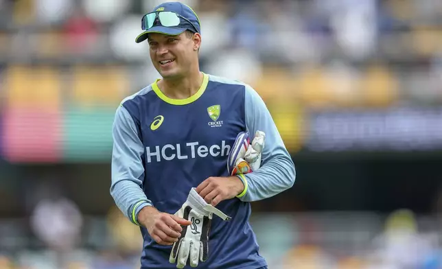 Australia's Alex Carey looks on ahead of day one of the third cricket test between India and Australia at the Gabba in Brisbane, Australia, Saturday, Dec. 14, 2024. (AP Photo/Pat Hoelscher)